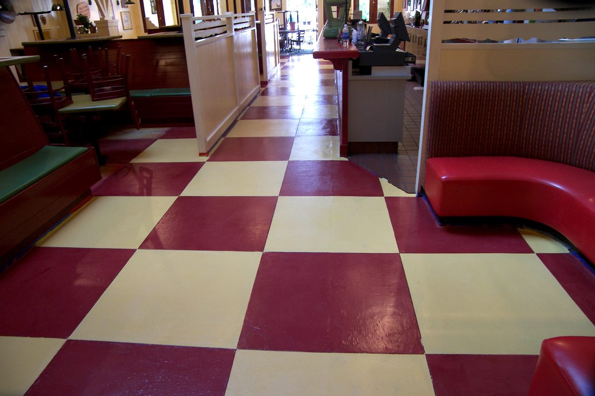 Restored high-gloss checkerboard floor after refinishing