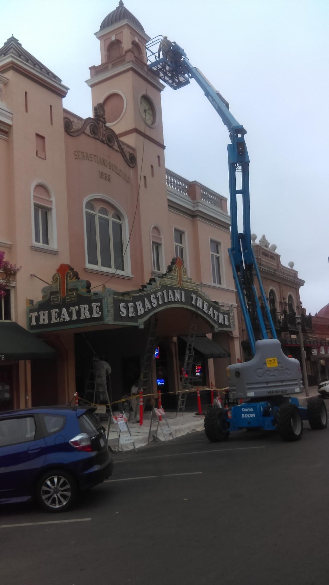 Lift positioned against the historic Sebastiani Theatre during a paint project
